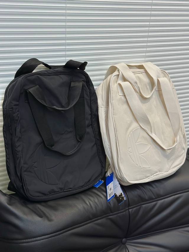 Top-of-the-line Adidas minimalist backpack, shoulder bag, and handbag. Couple's
