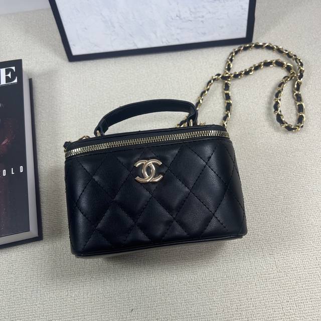 Comes with a designer gift box. This new Chanel cosmetics bag features a long c