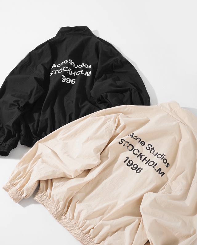 Acne1996 distressed print jacket. Made of custom-woven micro-pleated nylon. High