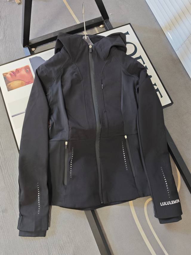 Details of Lulu slim-fit jacket. Soft shell jacket with splicing material and th