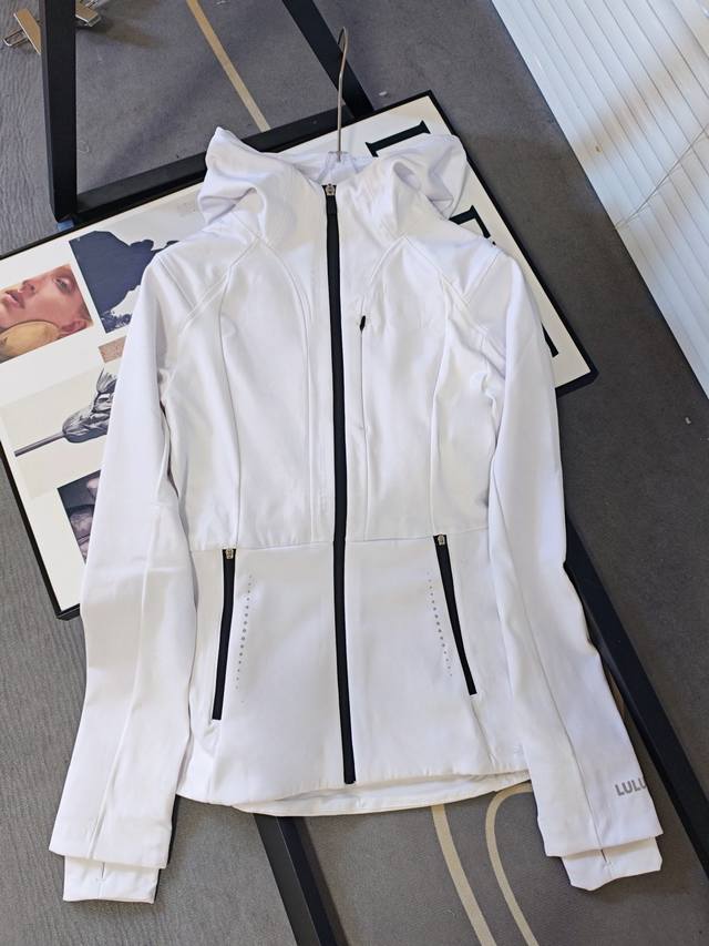 Details of Lulu slim-fit jacket. Soft-shell jacket with splicing material and th