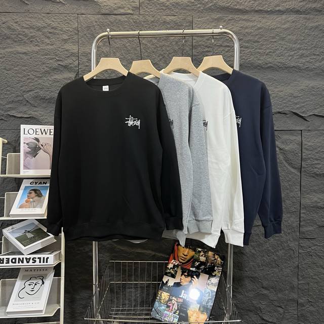 Stussy basic small logo embroidered round neck sweatshirt . The classic logo em