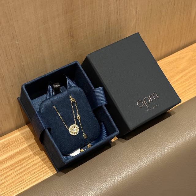 Apm's gold sun and star disc necklace is exquisite and versatile. The gold sun a