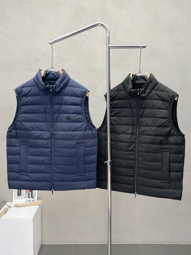 Exclusively from Armani, this stylish padded vest boasts a classic design and s