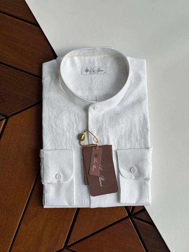 Close-up shot of white! An epic linen shirt, an exclusive Lp creation, featurin