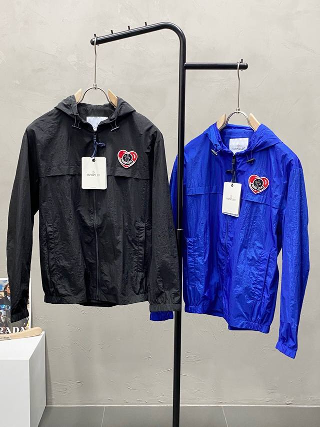 Exclusively from Moncler, this stylish hooded jacket boasts a classic design an