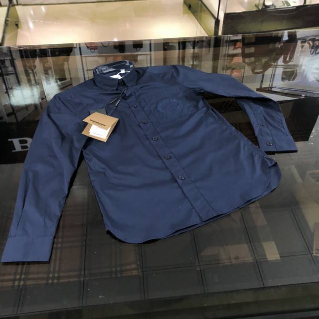 B's classic long-sleeved shirt embroidered with a vintage oak leaf emblem. Made