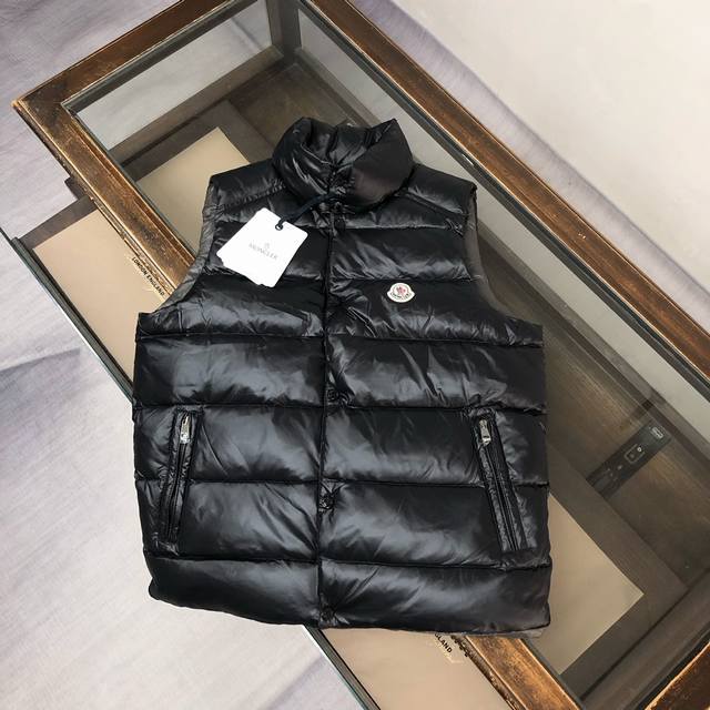 The Moncler classic down-filled Tib vest features a stand-up collar inspired by