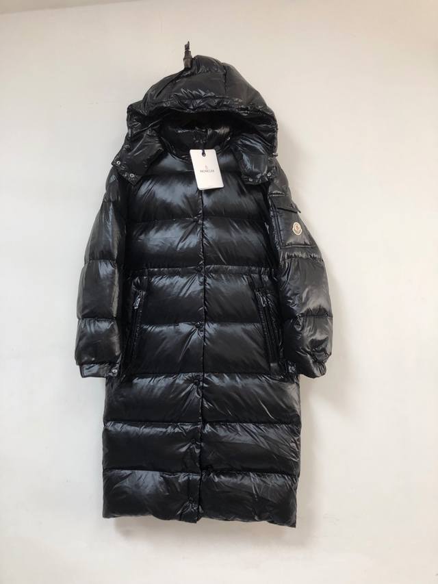 Women's Moncler. New winter women's long hooded down jacket Available in store.