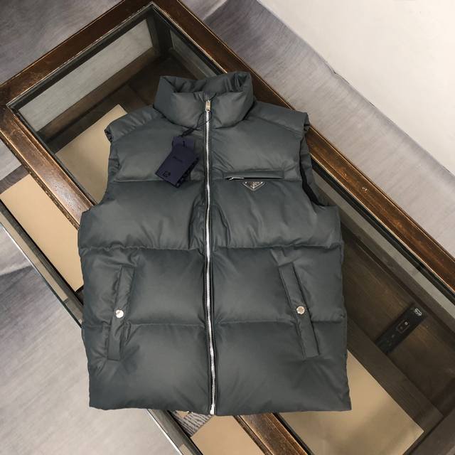 Prada's down vest is a blockbuster item, the most expensive of the year. The qua