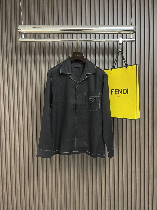 Prada's long-sleeved shirt with visible pockets and a triangle logo is made of
