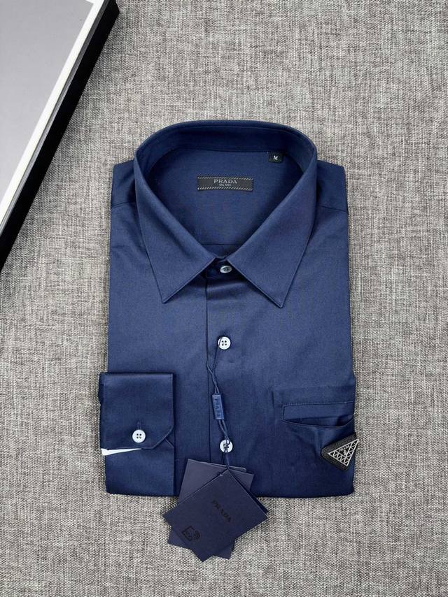 Restocking order, shipping in a solid navy blue, understated luxury... Prada, f