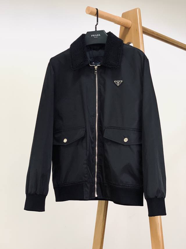 Prada's new fur collar, triangular micro-logo jacket from Prada's 2025 Early Fa