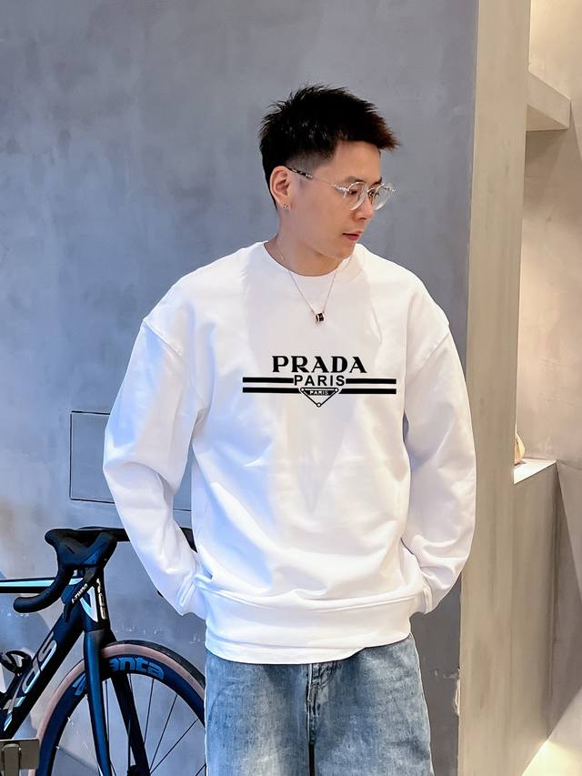 Prada's official website features a new double-layer, heavily-worked monogram pr