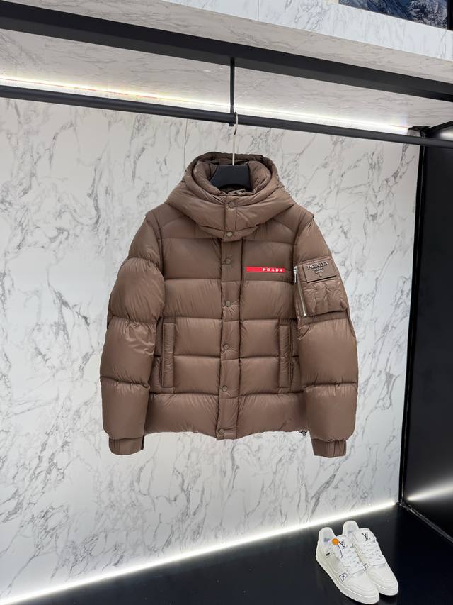 Prada's new jacquard nylon down jacket with a small metal logo. Crafted from Re Prada's new jacquard nylon down jacket with a small metal logo. Crafted from Re