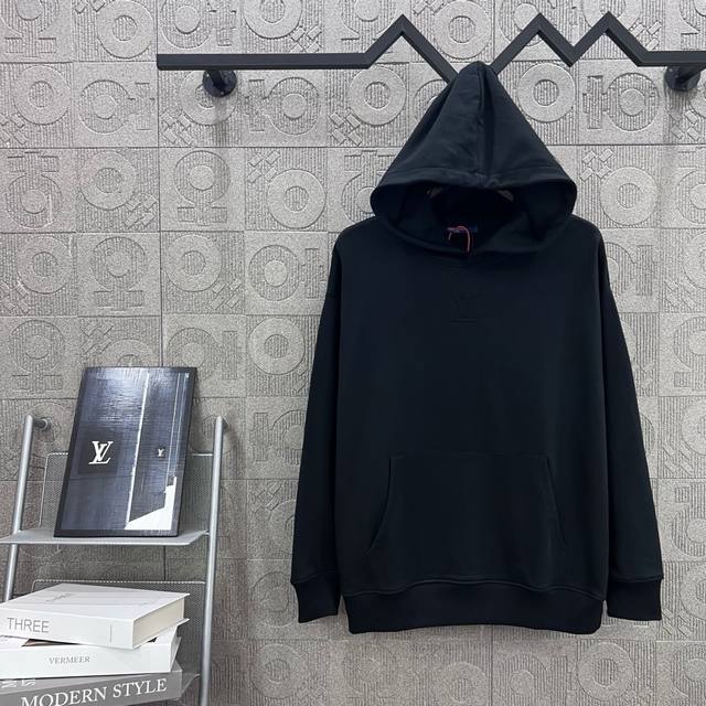 Louis Vuitton's streamlined, three-dimensional logo features embossed detailing.