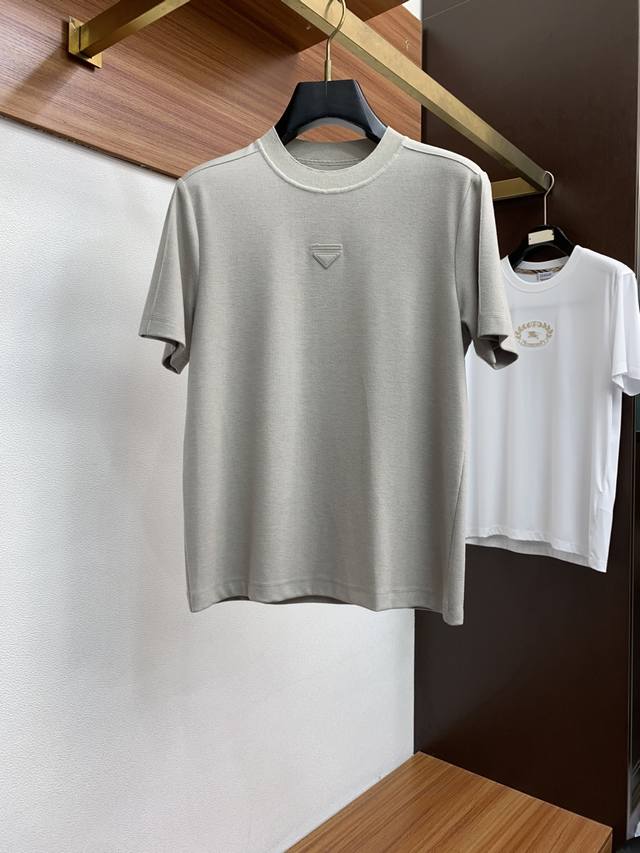 Prada's new fall/winter 2025 collection features stylish, casual short-sleeved T