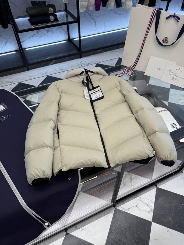 Moncler Forez men's hooded short down jacket. Hood is removable. Variable stand-