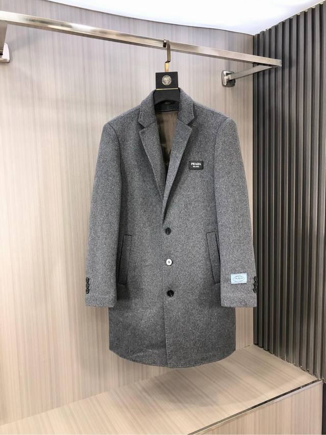 Prada's new men's cashmere Kensington coat for Fall/Winter 2025 features a deta