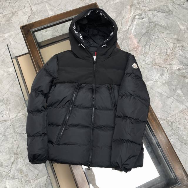 Moncler down jacket with large embroidered ribbon and monogram. This upgraded ve