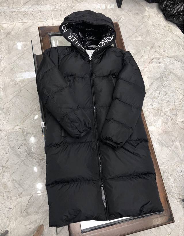 Moncler's new men's long hooded down jacket, also available for women. Features