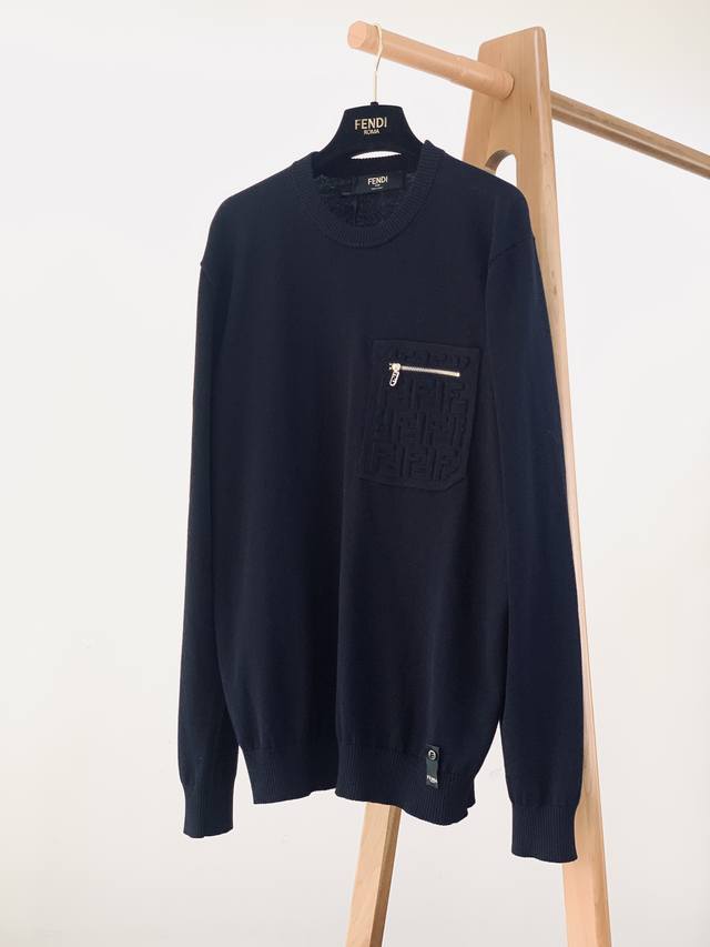 Fendi's navy blue pocket knit sweater is crafted from high-quality wool yarn for