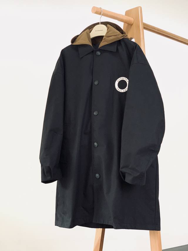 Burberry's Fake Two-Piece Hooded Trench Coat from the Burberry Early Fall 2025 c
