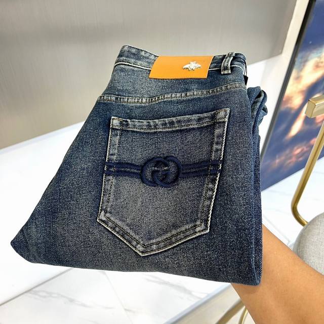 Gucci's new Fall/Winter 2025 men's washed jeans feature a deep indigo denim fabr