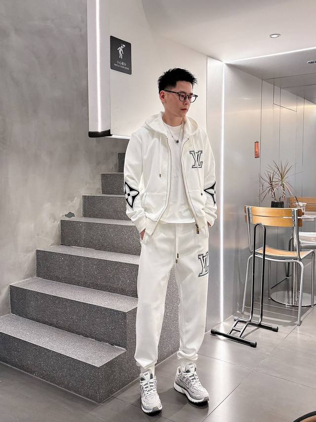 Lv Donkey 25 Years This black zip-up cotton hooded sweater is crafted from a del