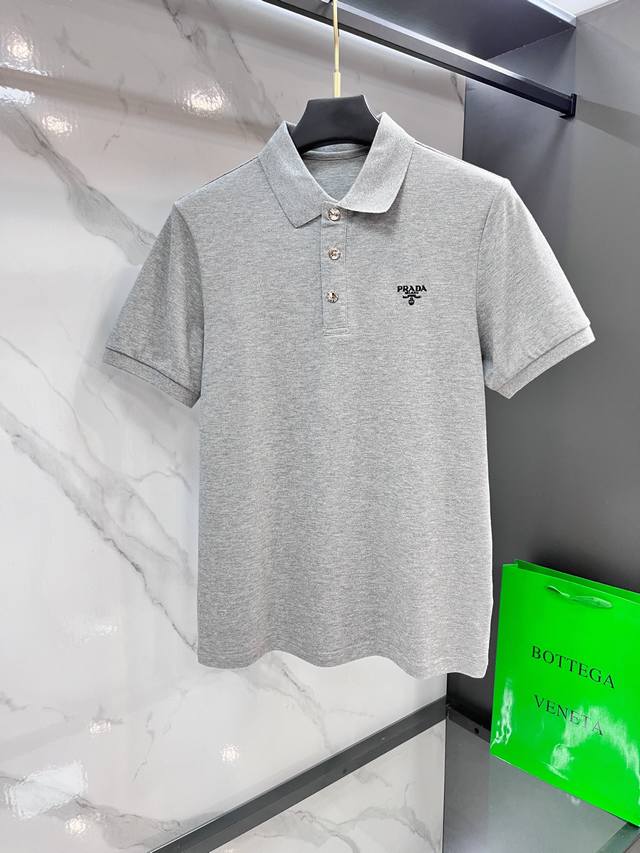 Prada's 2025S classic, iconic logo accents this stylish short-sleeved lapel polo