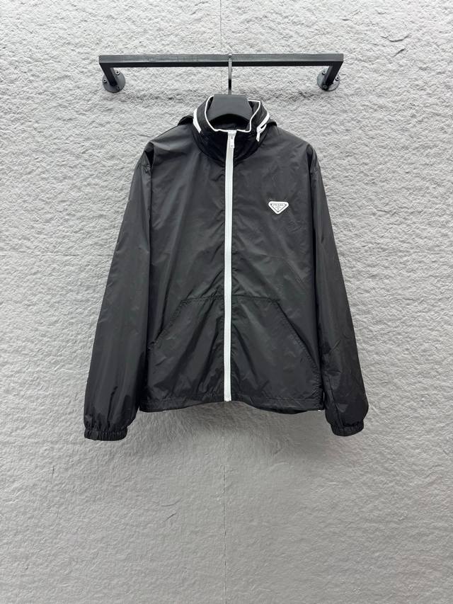 prade25Ss's new stand-up collar recycled nylon jacket blends sporty design with prade25Ss's new stand-up collar recycled nylon jacket blends sporty design with