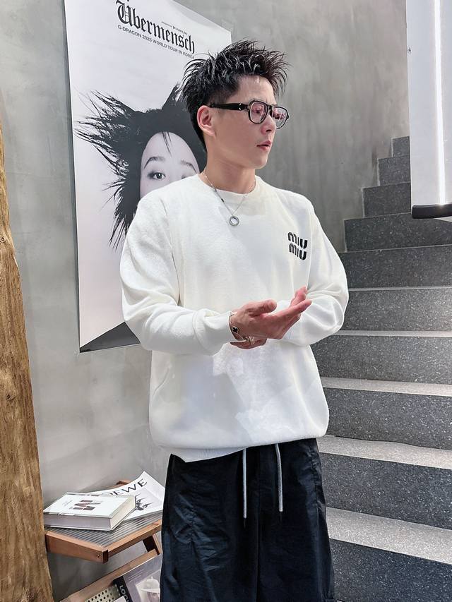 Miumiu Round Neck Crochet Pullover Sweater offers a luxurious, comfortable, and