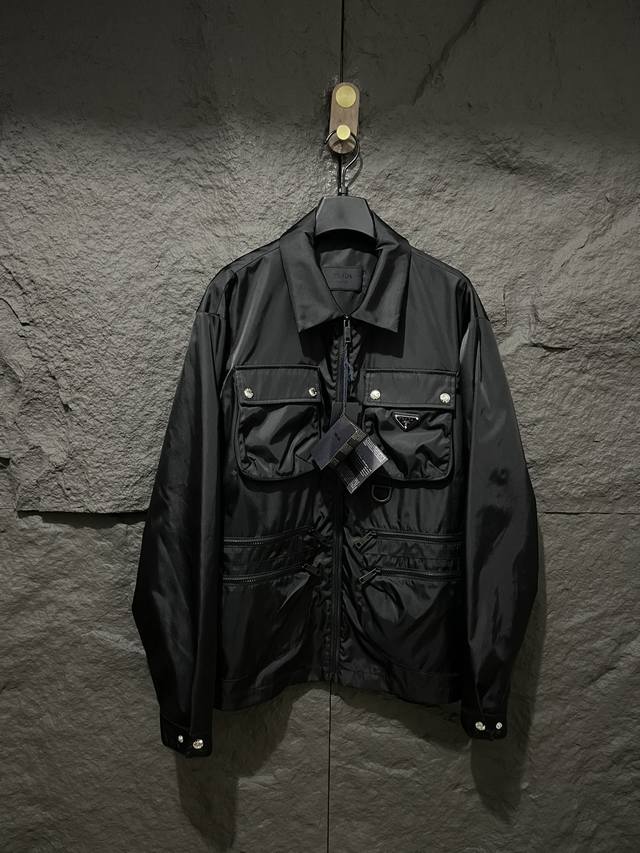 pra Prada 25 new zippered, multi-pocket, triangle-label jacket. Original design,