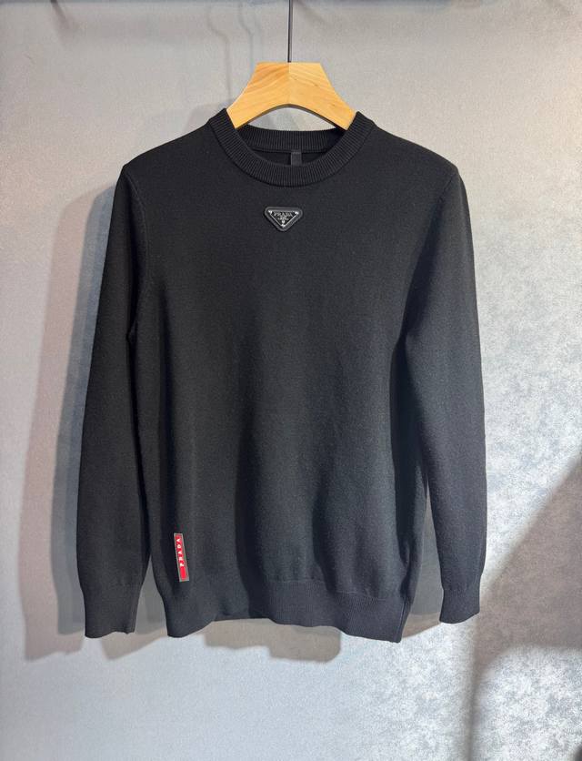Prada's simple autumn/winter wool sweater is a top-quality, versatile, and styli