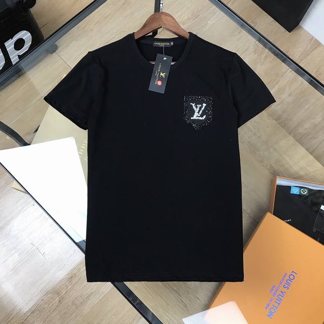 Lv This Louis Vuitton custom-made, three-dimensional, diamond-faced shield logo