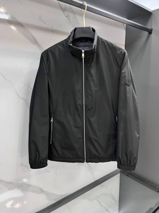 Moncler's 2025 Fall/Winter stand-up collar jacket features custom-woven and cust