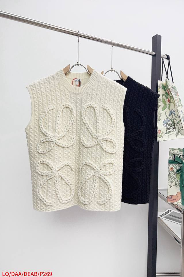 L0Ewe Wool Vest Mid-weight wool vest with hand-stitched anagram detail on front.