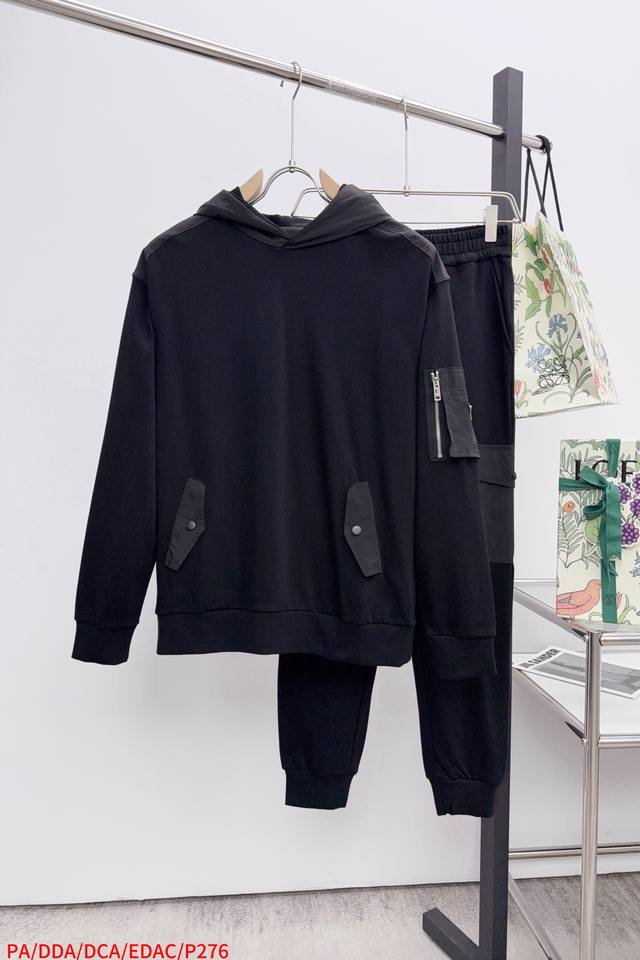 Tops and Pants pa This black hooded sweatshirt from Prada is the perfect blend o