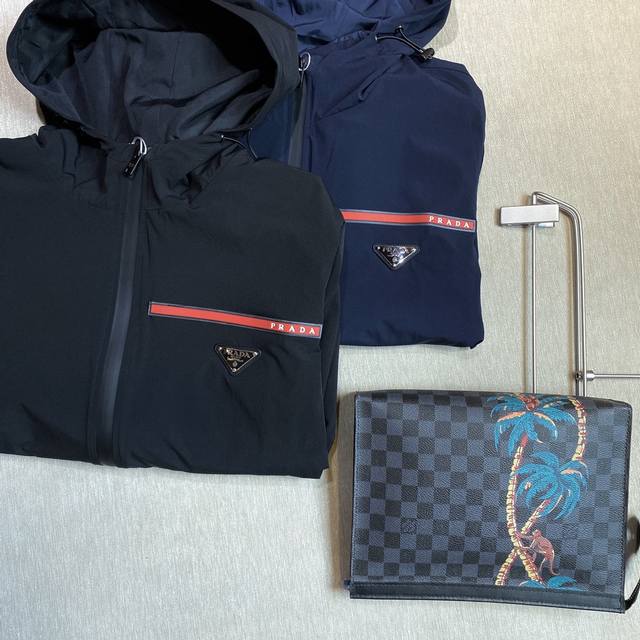 Prada: The latest early fall trench coat from the official website, featuring h