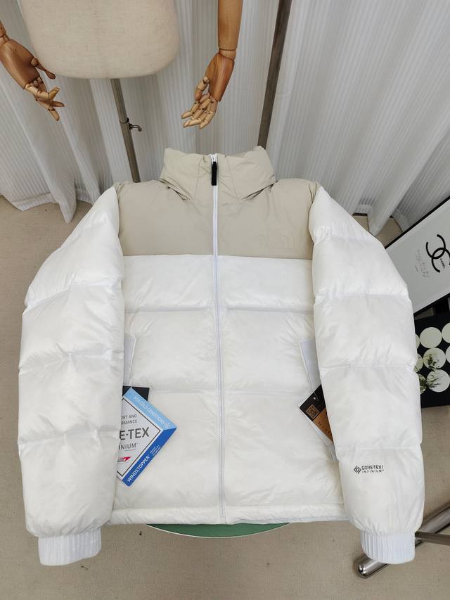 The North Face Gtx Nuptse Jacket is a seamless, embossed, and laminated down jac