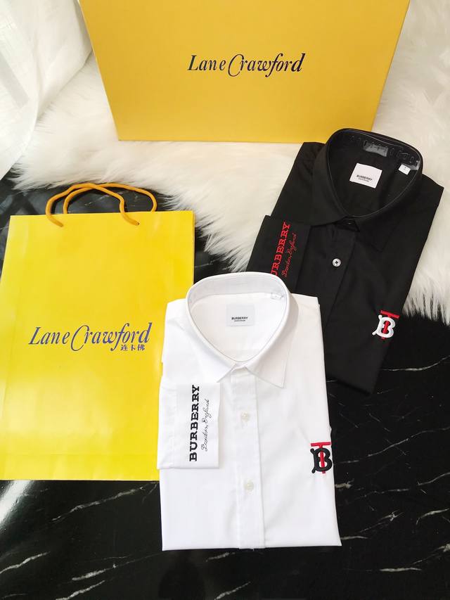 Burberry SS latest model features contrasting red and black embroidery on the ch