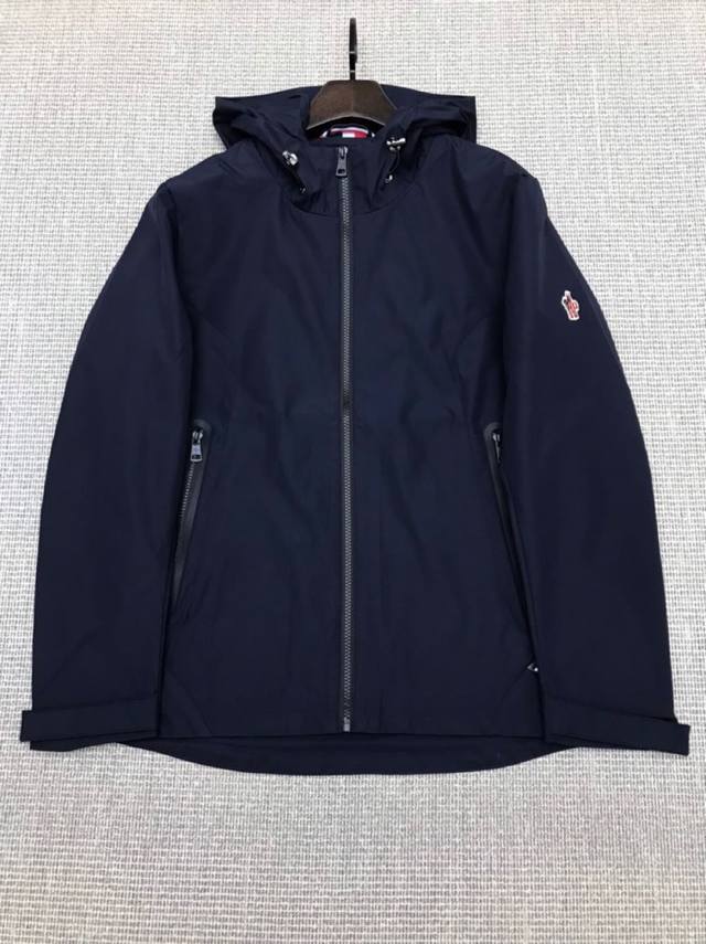 Moncler's early autumn men's casual hooded jacket with classic logo patches on t