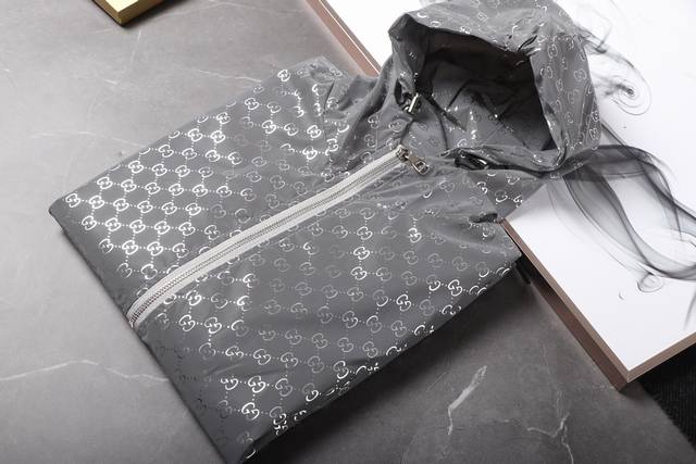 A Gucci counter model, this new unisex, color-blocked, lightweight jacket with a