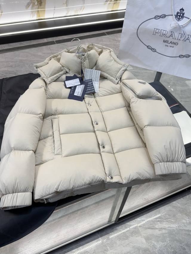 Prada ultra-light tear-resistant down jacket. Hood is detachable. More details
