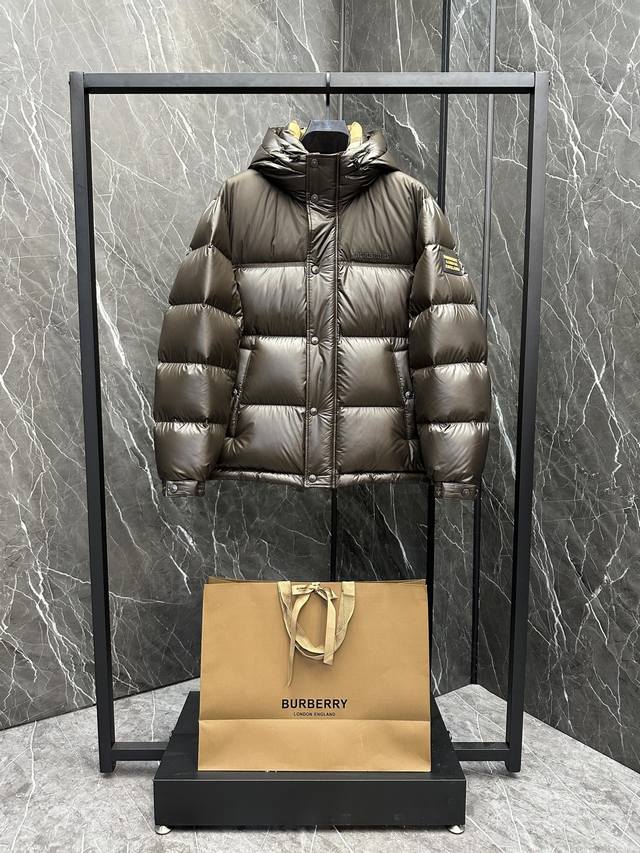 Burberry hooded down jacket with contrasting tape and Burberry logo. Lined with