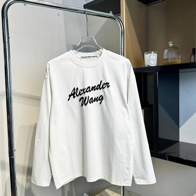 aw Alexander Wang long-sleeved T-shirt with embossed logo print. The loose fit i