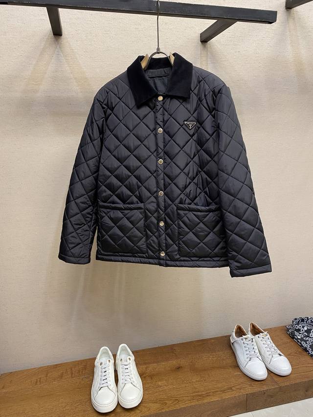 Prada's new triangular-logo diamond-patterned cotton jacket ( ) is exclusively l