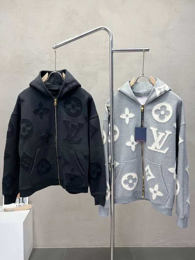 Exclusively from Louis Vuitton, this stylish, thickened hooded jacket features a