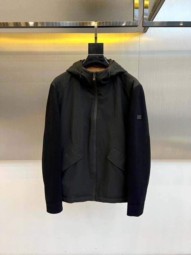Zegna's new black hooded jacket for Fall/Winter 2025 showcases a minimalist desi