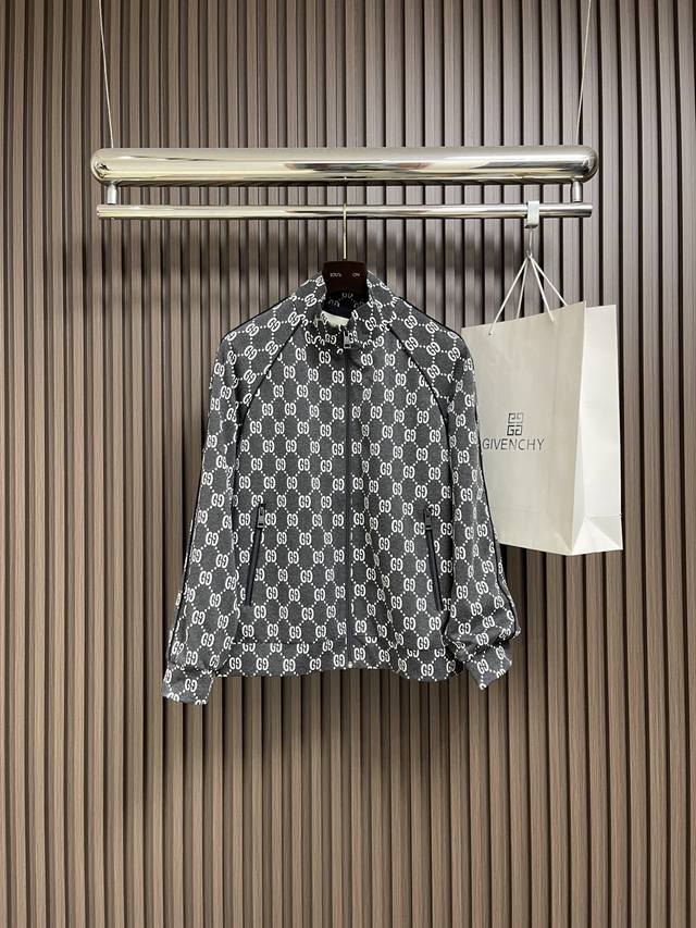 Gucci 2025S printed stand-up collar jacket, featuring a dark grey base covered w